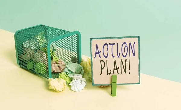 Text sign showing Action Plan. Conceptual photo proposed strategy or course of actions for certain time Trash bin crumpled paper clothespin empty reminder office supplies tipped.