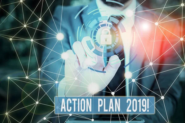 Writing note showing Action Plan 2019. Business photo showcasing proposed strategy or course of actions for current year Picture photo network scheme with modern smart device.