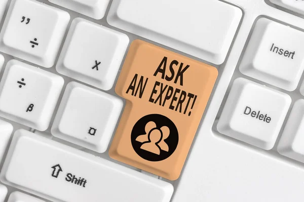 Conceptual hand writing showing Ask An Expert. Business photo text confirmation that have read understand and agree with guidelines White pc keyboard with note paper above the white background.