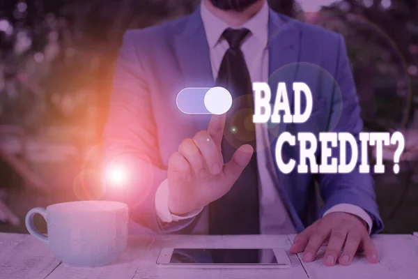 Conceptual hand writing showing Bad Creditquestion. Business photo text inabilityof a demonstrating to repay a debt on time and in full Male wear formal work suit presenting presentation smart device. — Stock Photo, Image