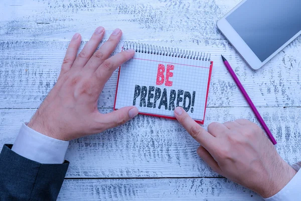 Text sign showing Be Prepared. Conceptual photo try be always ready to do or deal with something Hand hold note paper near writing equipment and modern smartphone device. — Stock Photo, Image