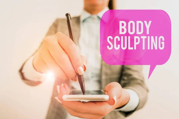 Word writing text Body Sculpting. Business concept for activity of increasing the body s is visible muscle tone Business woman pointing in empty space with pen.