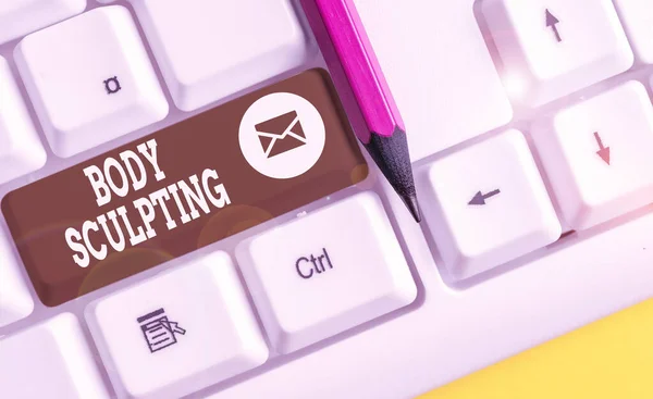 Writing note showing Body Sculpting. Business photo showcasing activity of increasing the body s is visible muscle tone White pc keyboard with note paper above the white background.