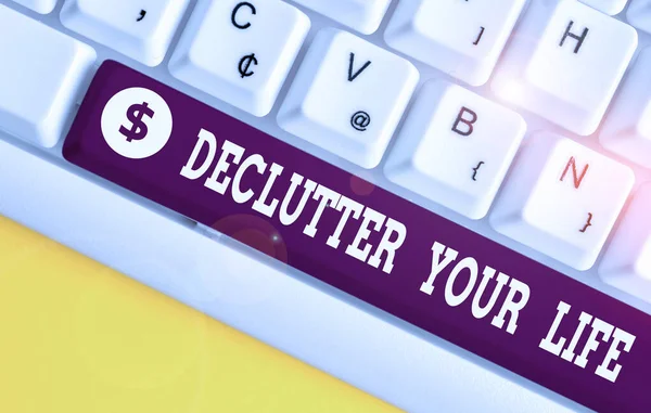 Handwriting text Declutter Your Life. Concept meaning To eliminate extraneous things or information in life White pc keyboard with empty note paper above white background key copy space. — Stock Photo, Image