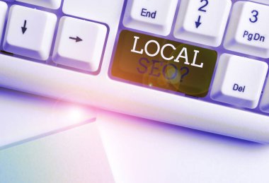 Kelime yazma metin Yerel Seoquestion. Beyaz arka plan tuşu kopyalama alanı üzerinde boş not kağıdı ile yerel iş online Beyaz pc klavye pazarlamak için inanılmaz etkili bir yol için iş konsepti.