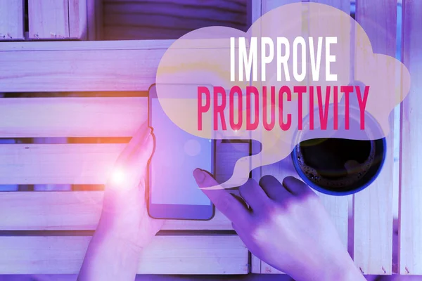 Text tecken som visar förbättrad produktivitet. Konceptuell bild för att öka maskin-och processeffektivitet kvinna dator smartphone dricka mugg kontorsmateriel tekniska enheter. — Stockfoto