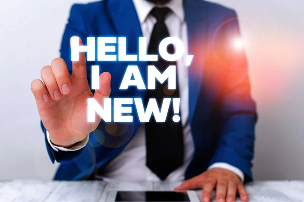 Escribir texto a mano Hello I Am New. Concepto significado utilizado como saludo o para iniciar conversación telefónica Empresario con el dedo en la punta delante de él . —  Fotos de Stock
