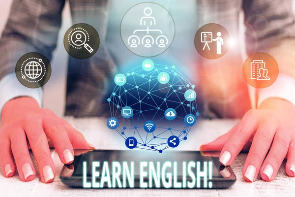 Conceptual hand writing showing Learn English. Business photo text gain acquire knowledge in new language by study Female human wear formal work suit presenting smart device. — Stock Photo, Image