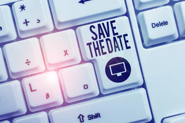Text sign showing Save The Date question. Conceptual photo asking someone to remember specific day or time White pc keyboard with empty note paper above white background key copy space.