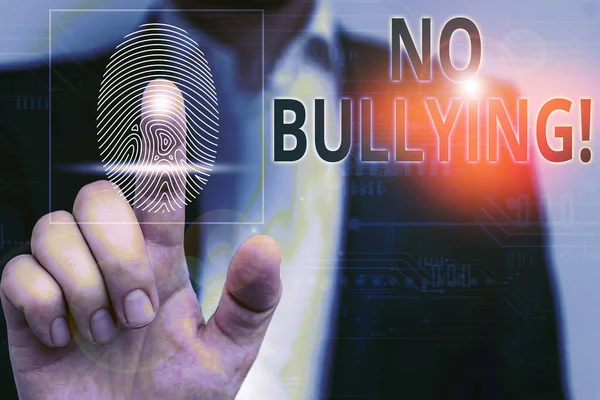 Handwriting text No Bullying. Concept meaning stop aggressive behavior among children power imbalance Male human wear formal work suit presenting presentation using smart device.