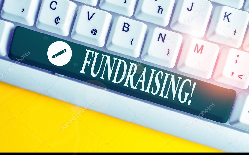 Writing note showing Fundraising. Business photo showcasing seeking to generate financial support for charity or cause White pc keyboard with note paper above the white background.