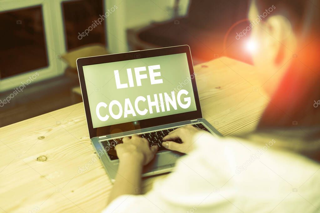 Conceptual hand writing showing Life Coaching. Business photo text Improve Lives by Challenges Encourages us in our Careers woman with laptop smartphone and office supplies technology.