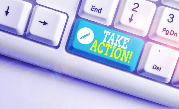 Handwriting text Take Action. Concept meaning do something official or concerted to achieve aim with problem White pc keyboard with empty note paper above white background key copy space. — Stock Photo, Image