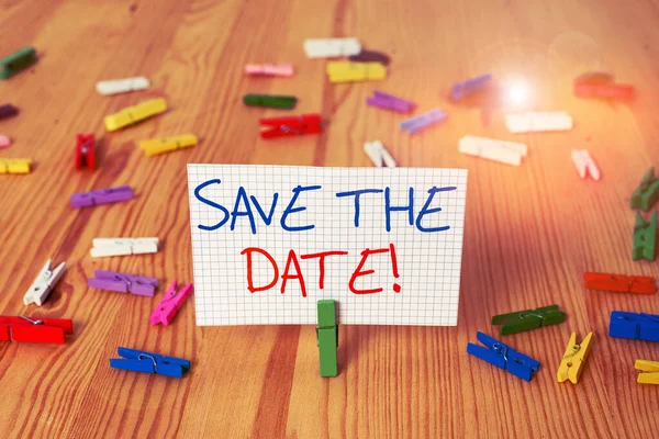 Text sign showing Save The Date. Conceptual photo Organizing events well make day special event organizers Colored clothespin papers empty reminder wooden floor background office. — Stock Photo, Image