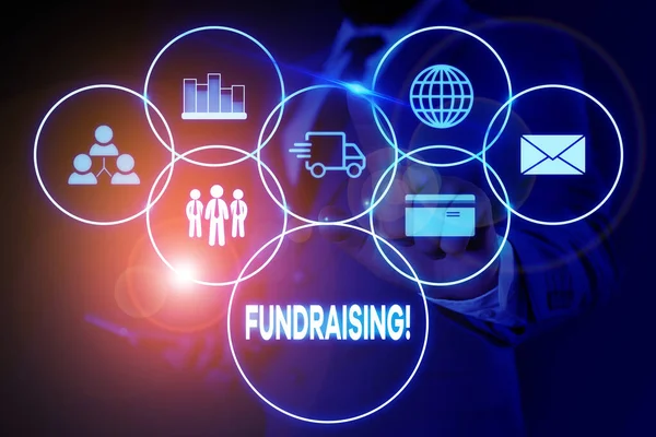 Text sign showing Fundraising. Conceptual photo seeking to generate financial support for charity or cause Male human wear formal work suit presenting presentation using smart device. — Stock Photo, Image