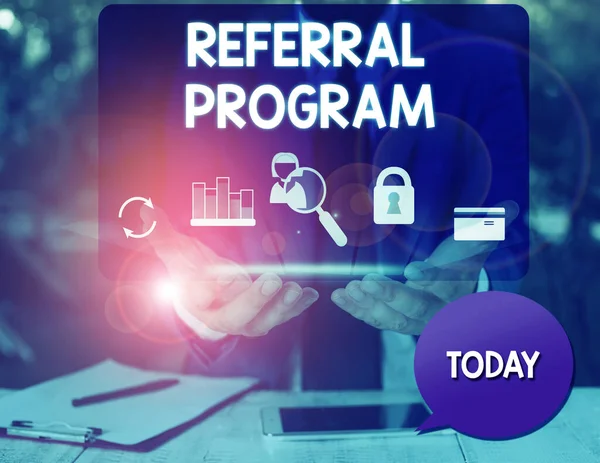Text sign showing Referral Program. Conceptual photo employees are rewarded for introducing suitable recruits man icons smartphone speech bubble office supplies technological device.