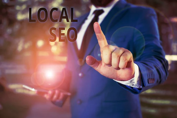 Word writing text Local Seo. Business concept for helps businesses promote products and services to local customers Businessman with pointing finger in front of him. — Stock Photo, Image