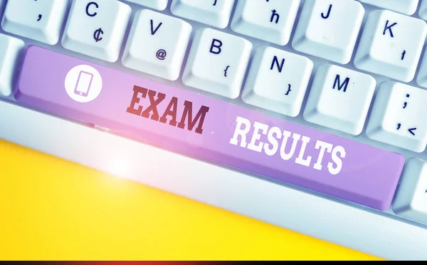 Conceptual hand writing showing Exam Results. Business photo showcasing An outcome of a formal test that shows knowledge or ability White pc keyboard with note paper above the white background.