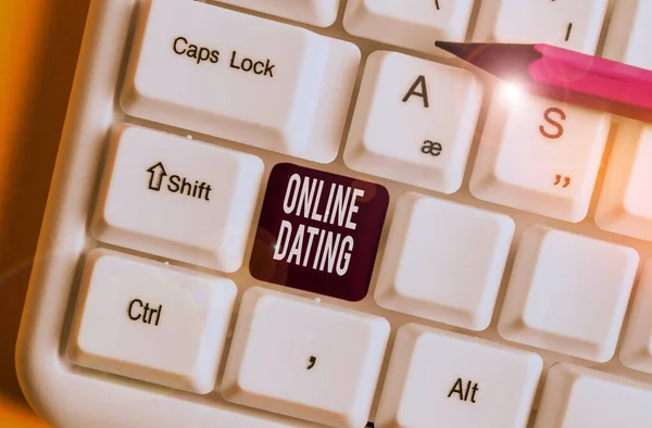 Handwriting text writing Online Dating. Concept meaning Searching Matching Relationships eDating Video Chatting White pc keyboard with empty note paper above white background key copy space. — Stock Photo, Image