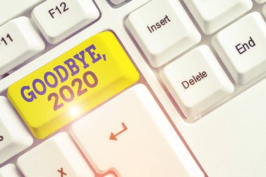 Handwriting text Goodbye 2020. Concept meaning New Year Eve Milestone Last Month Celebration Transition White pc keyboard with empty note paper above white background key copy space. clipart