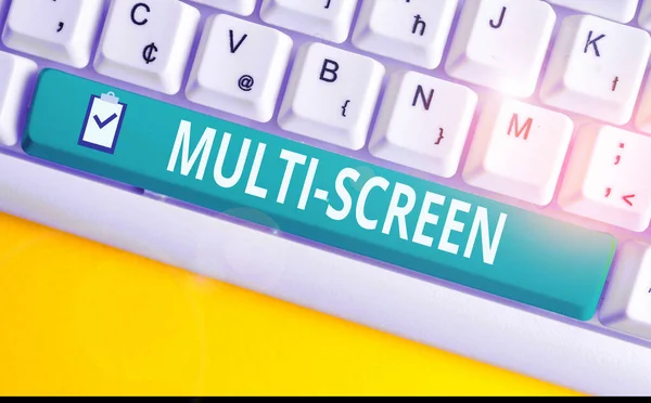 Handwriting text writing Multi Screen. Concept meaning Having or involving several screen especially in a cinema White pc keyboard with empty note paper above white background key copy space.