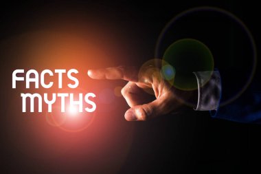 El yazısı metin yazma Gerçekler Mitler. Kavram anlamı iş gerçek hayat farkı yerine hayal gücüne dayalı Izole el parmak la işaret. İş kavramı işaret parmağı.