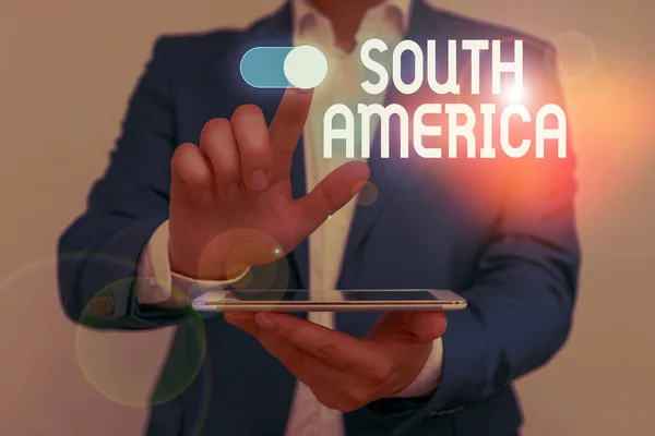 Word writing text South America. Business concept for Continent in Western Hemisphere Latinos known for Carnivals Male human wear formal work suit presenting presentation using smart device. — Stock Photo, Image