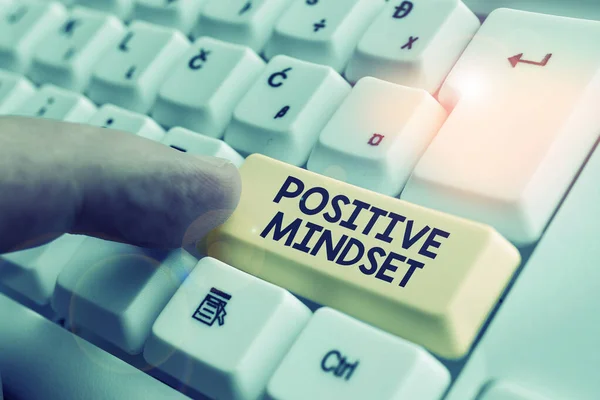 Writing note showing Positive Mindset. Business photo showcasing mental attitude in wich you expect favorable results White pc keyboard with note paper above the white background.