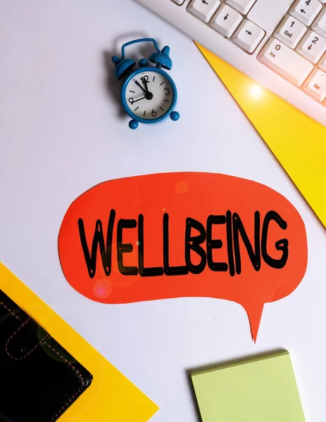 Word writing text Wellbeing. Business concept for A good or satisfactory condition of existence including health Flat lay with copy space on bubble paper clock and paper clips. — Stock Photo, Image