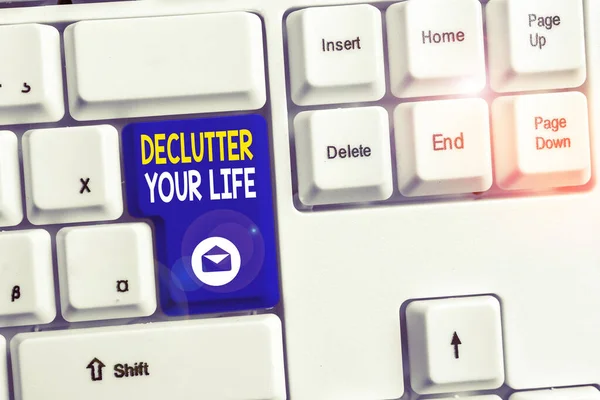 Word writing text Declutter Your Life. Business concept for To eliminate extraneous things or information in life White pc keyboard with empty note paper above white background key copy space. — Stock Photo, Image