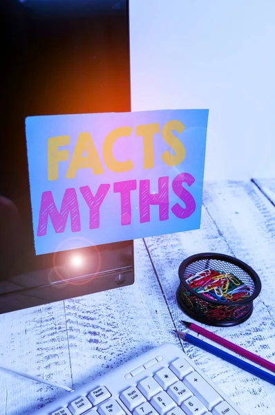 Writing note showing Facts Myths. Business photo showcasing work based on imagination rather than on real life difference Note paper taped to black computer screen near keyboard and stationary. — Stock Photo, Image