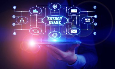 Conceptual hand writing showing Energy Usage. Business photo showcasing Amount of energy consumed or used in a process or system Woman wear work suit presenting presentation smart device.