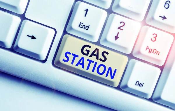 Text sign showing Gas Station. Conceptual photo for servicing motor vehicles especially with gasoline and oil White pc keyboard with empty note paper above white background key copy space. — Stock Photo, Image