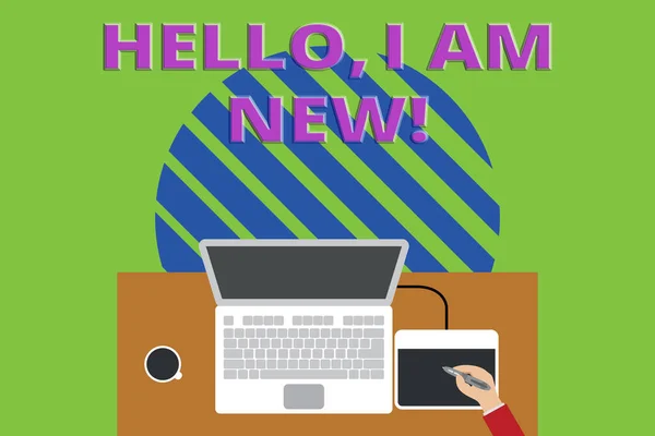 Writing note showing Hello I Am New. Business photo showcasing introducing oneself in a group as fresh worker or student Upper view laptop wooden desk worker drawing tablet coffee cup office. — Stockfoto