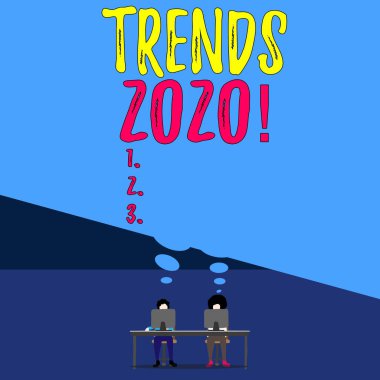 Yazarlık Eğilimleri 2020. Bir şeylerin geliştiği ya da değiştiği genel bir yön olan kavram. Masanın arkasında oturan iki adam. Her dizüstü bilgisayar boş bir düşünce balonunu paylaşıyor..