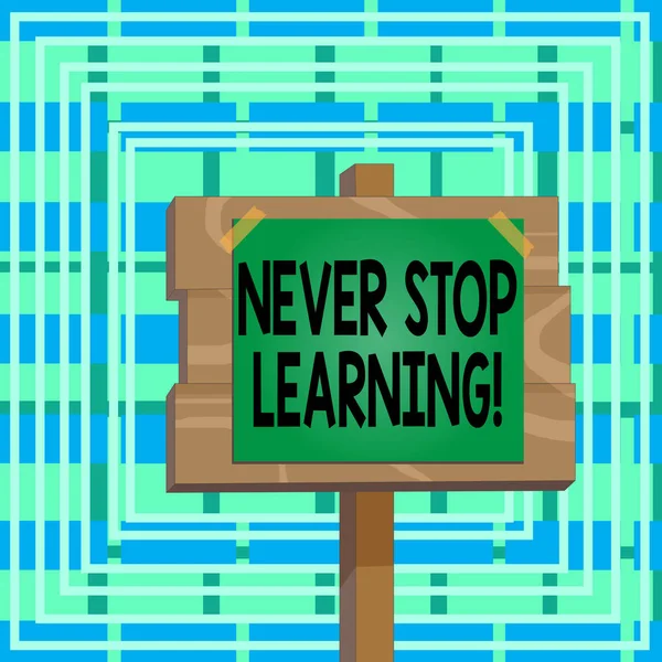 Text sign showing Never Stop Learning. Conceptual photo keep on studying gaining new knowledge or materials Wood plank wooden stick pole paper note attached adhesive tape empty space. — Stock Photo, Image