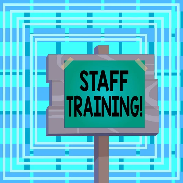 Text sign showing Staff Training. Conceptual photo program that helps employees learn specific knowledge Wood plank wooden stick pole paper note attached adhesive tape empty space.