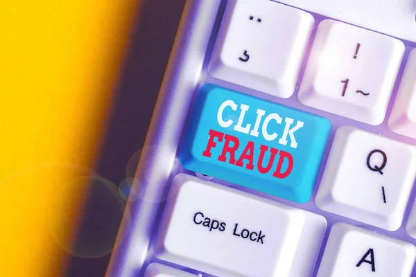 Writing note showing Click Fraud. Business photo showcasing practice of repeatedly clicking on advertisement hosted website White pc keyboard with note paper above the white background. — Stock Photo, Image