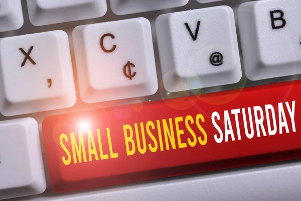 Word writing text Small Business Saturday. Business concept for American shopping holiday held during the Saturday White pc keyboard with empty note paper above white background key copy space.