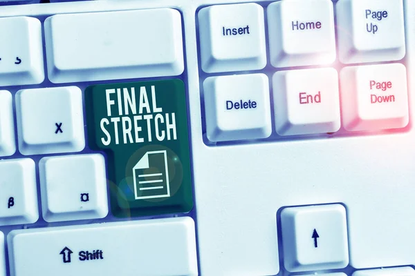 Conceptual hand writing showing Final Stretch. Business photo showcasing Last Leg Concluding Round Ultimate Stage Finale Year ender White pc keyboard with note paper above the white background. — Stock Photo, Image