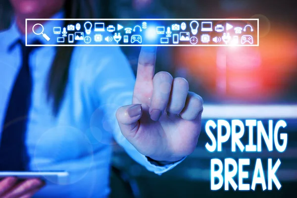 Handwriting text writing Spring Break. Concept meaning Vacation period at school and universities during spring Woman wear formal work suit presenting presentation using smart device. — Stock Photo, Image