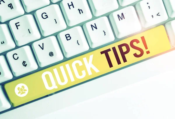 Word writing text Quick Tips. Business concept for small but particularly useful piece of practical advice White pc keyboard with empty note paper above white background key copy space.