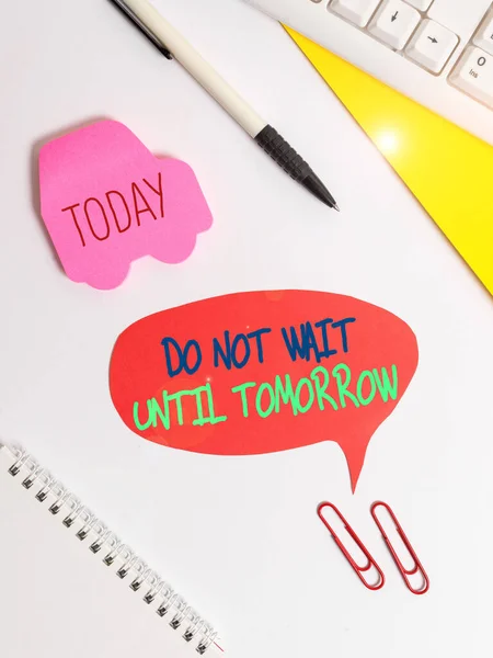 Text sign showing Do Not Wait Until Tomorrow. Conceptual photo needed to do it right away Urgent Better do now Red bubble copy space paper on the table with clock. — Stock Photo, Image