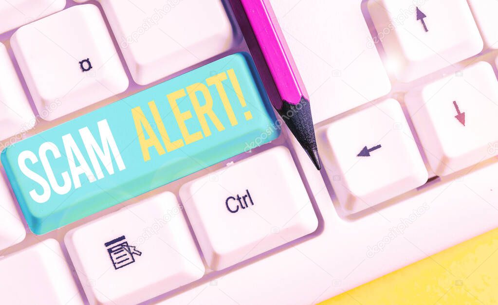 Handwriting text writing Scam Alert. Concept meaning fraudulently obtain money from victim by persuading him White pc keyboard with empty note paper above white background key copy space.