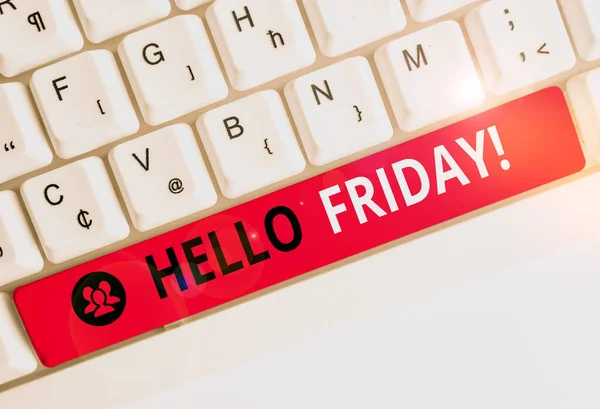 Writing note showing Hello Friday. Business photo showcasing used to express happiness from beginning of fresh week White pc keyboard with note paper above the white background.