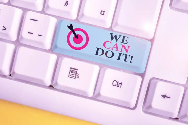Text sign showing We Can Do It. Conceptual photo see yourself as powerful capable demonstrating White pc keyboard with empty note paper above white background key copy space.