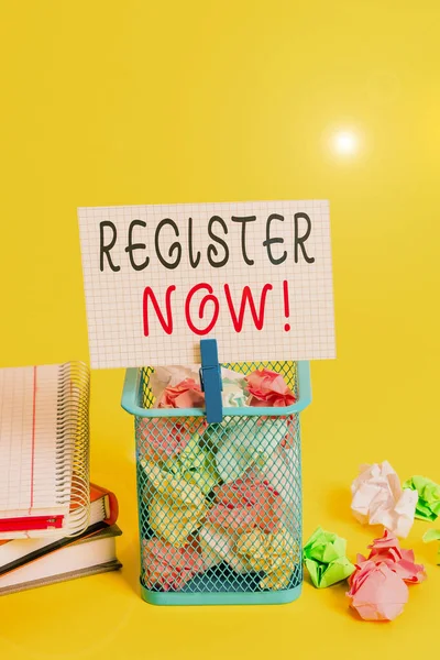 Conceptual hand writing showing Register Now. Business photo text official list or record showing or things into forum Trash bin crumpled paper clothespin office supplies yellow.
