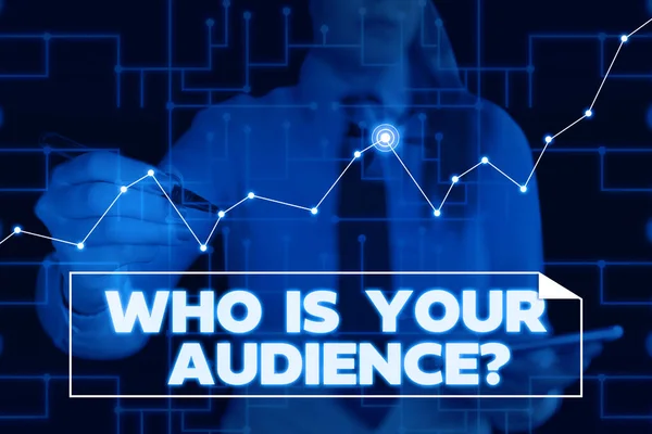 Text sign showing Who Is Your Audience Question. Conceptual photo who is watching or listening to it Woman wear formal work suit present presentation using smart latest device.