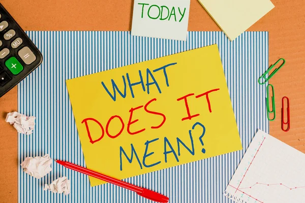 Word writing text What Does It Mean question. Business concept for intended to communicate unclear statement Striped paperboard notebook cardboard office study supplies chart paper. — Stock Photo, Image