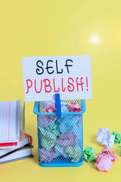 Conceptual hand writing showing Self Publish. Business photo text writer publish piece of ones work independently at own expense Trash bin crumpled paper clothespin office supplies yellow. — Stock Photo, Image